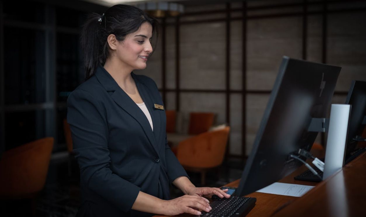 Professional Receptionist at Work in Islamabad Hotel