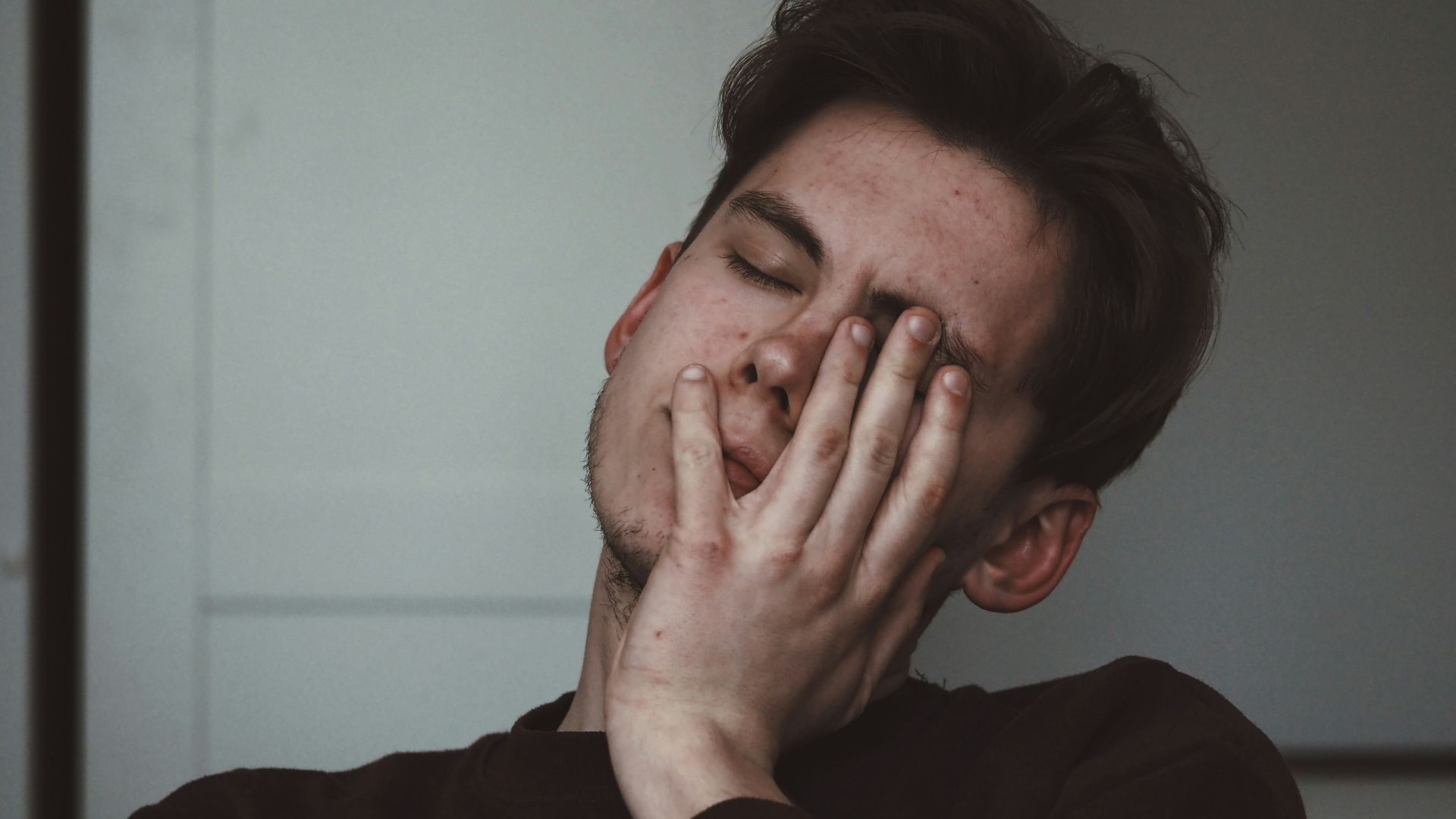 man wearing black crew-neck top