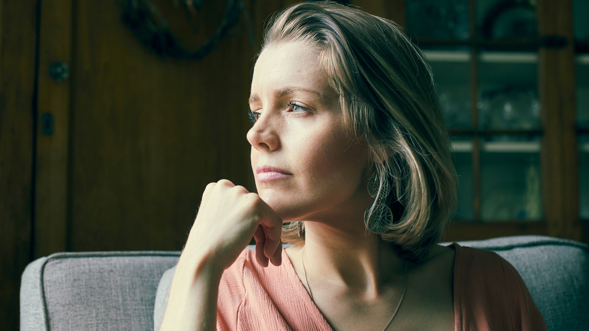 a woman sitting on a couch in a room