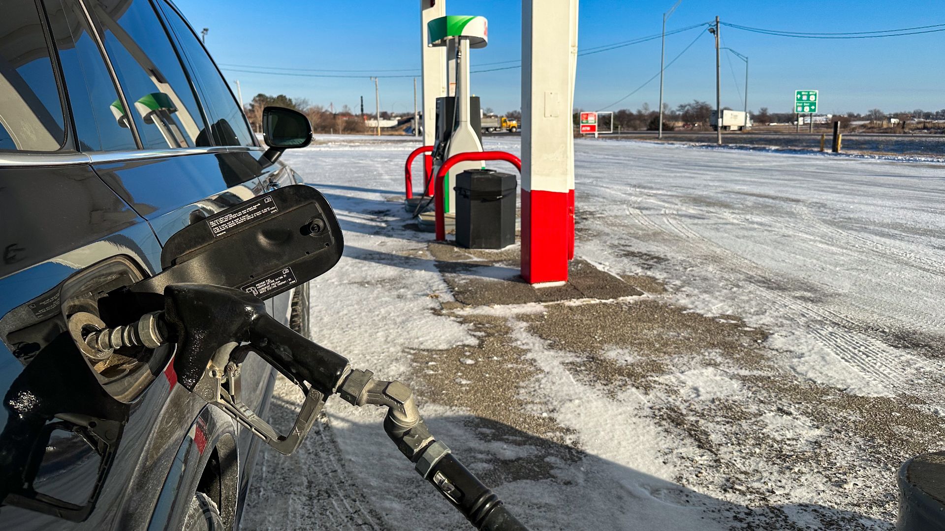 Filling up gas tank at Phillips 66, 1218 S. Division Street, Stuart, Iowa.
