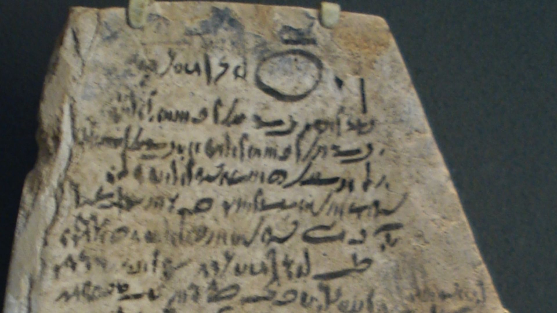 Ostracon with Demotic inscription.  Limestone.  Ptolemaic Period, c. 305-30 BC-(?330-305 BC?).  Probably from Thebes.  It is a prayer to the god Amun to heal a man's blindness.  It concludes: