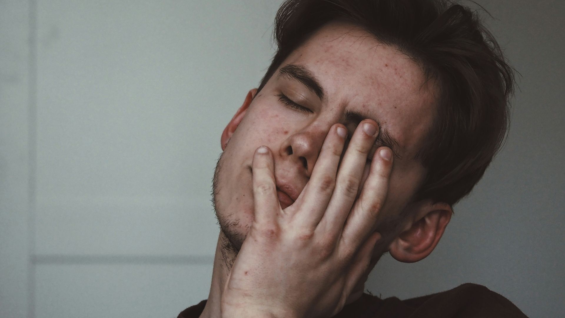 man wearing black crew-neck top