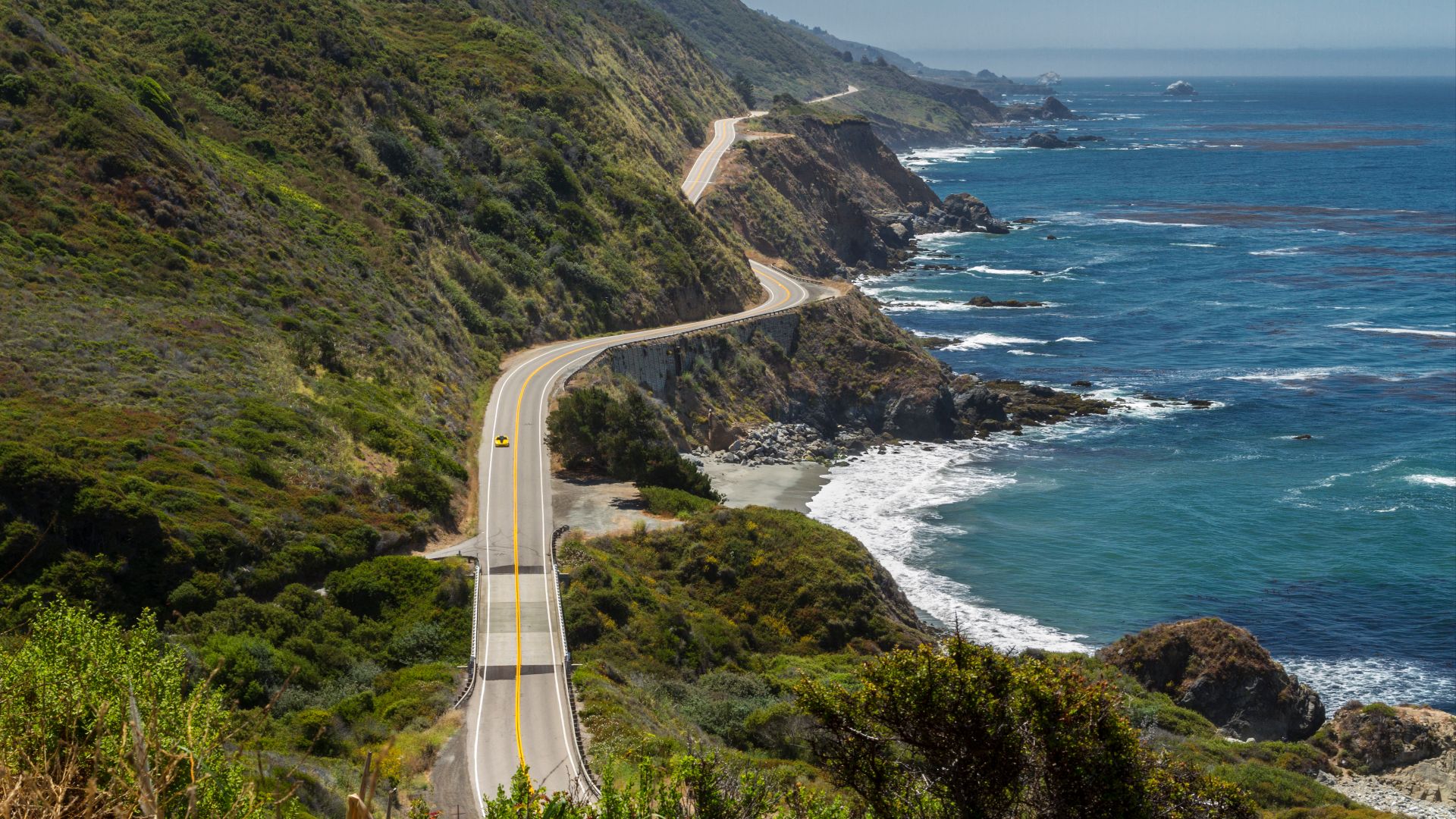 Highway 1 in Big Sur, California, clings to the coastal cliffs over much of its distance. This view looking south is about one mile north of Ragged Point, near the southern end of the Big Sur region.
