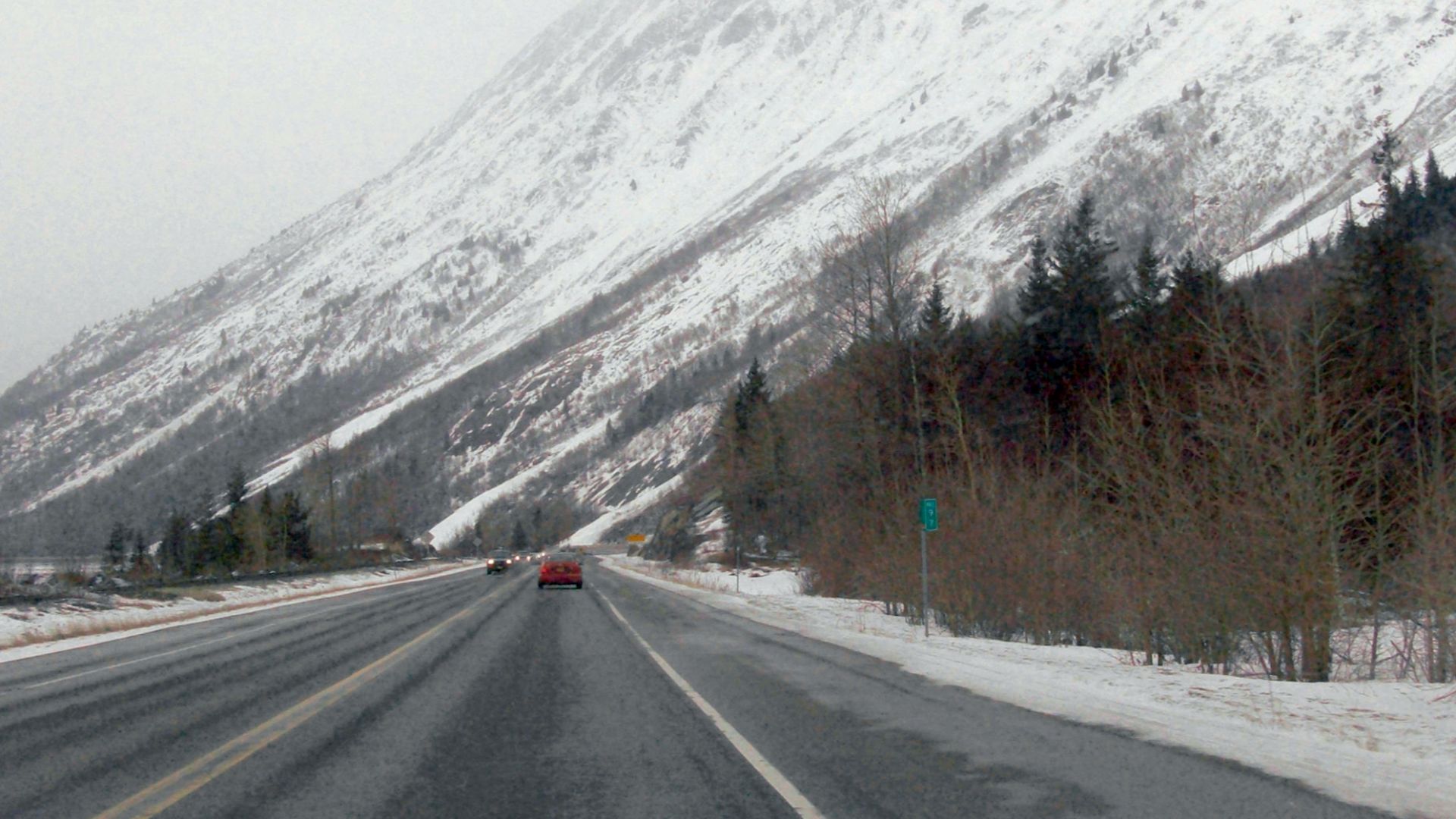 Seward Highway west of Girdwood headed to Anchorage at mile marker 97.  This mile marker is 97 miles from the beginning of the Seward Highway in Seward.  The mile marker does not represent mileage on Alaska Route 1. (time stamp is incorrect)