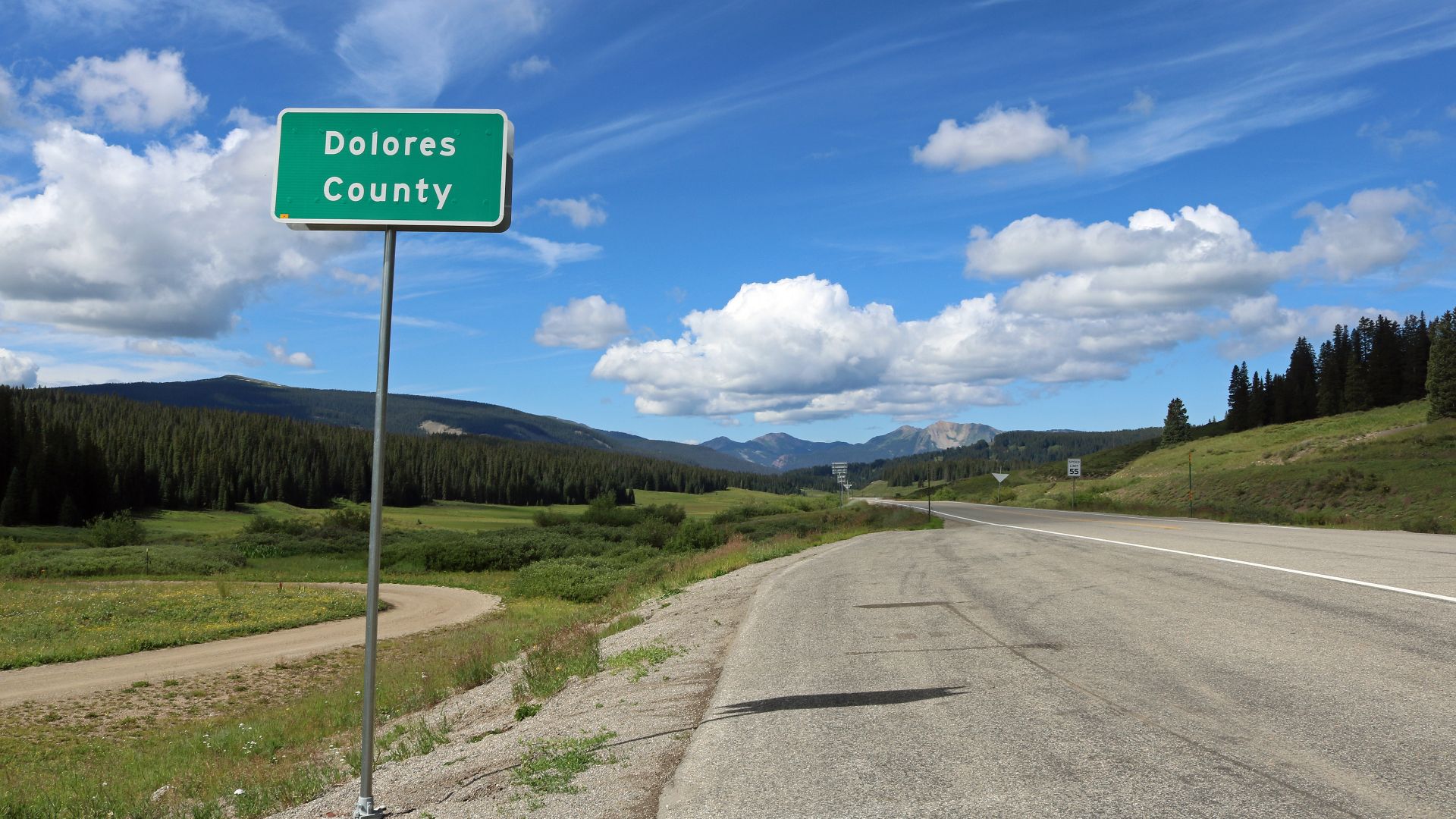 The Dolores County sign at Lizard Head Pass on Colorado State Highway 145.