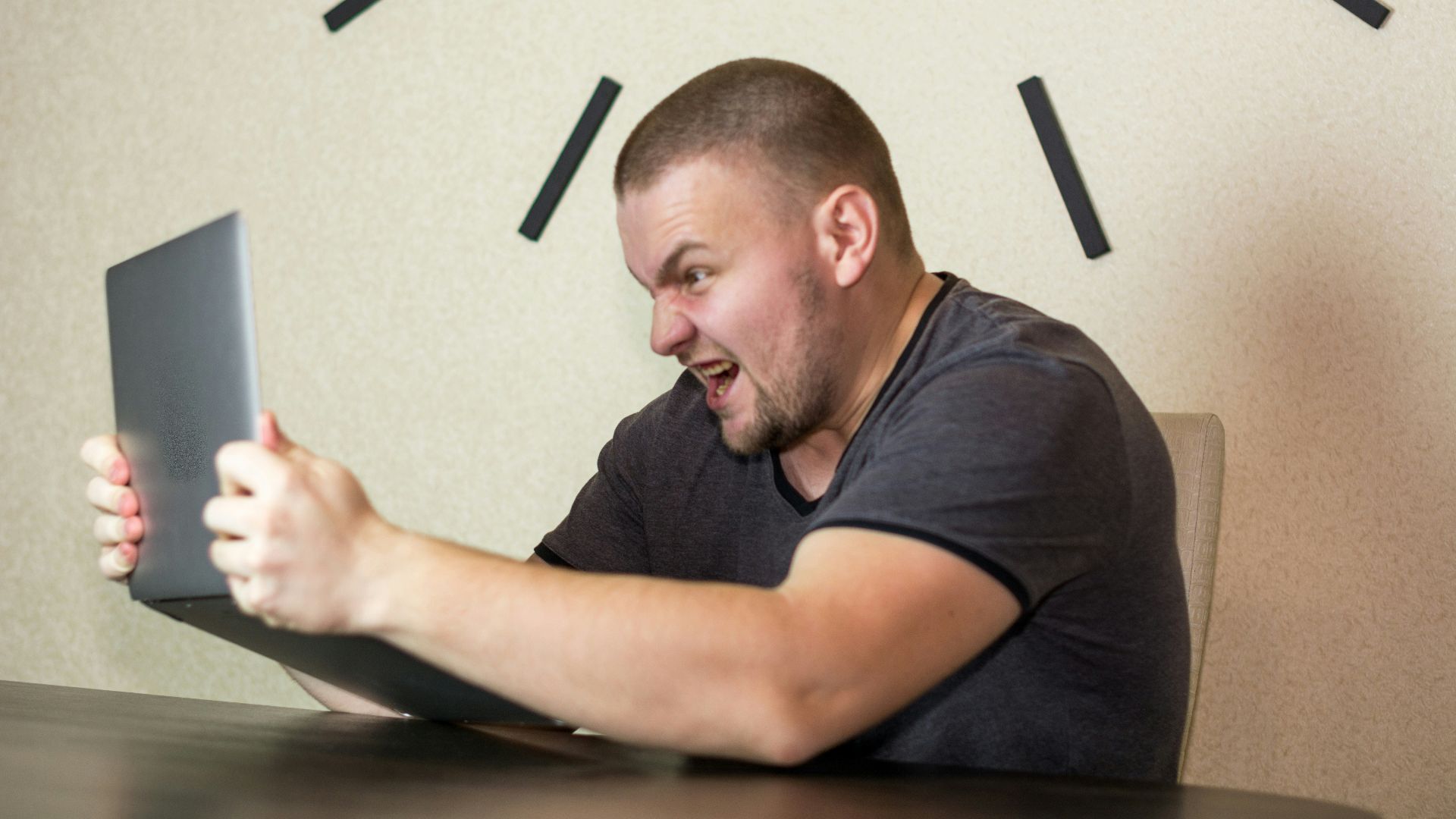 a man sitting in front of a laptop computer