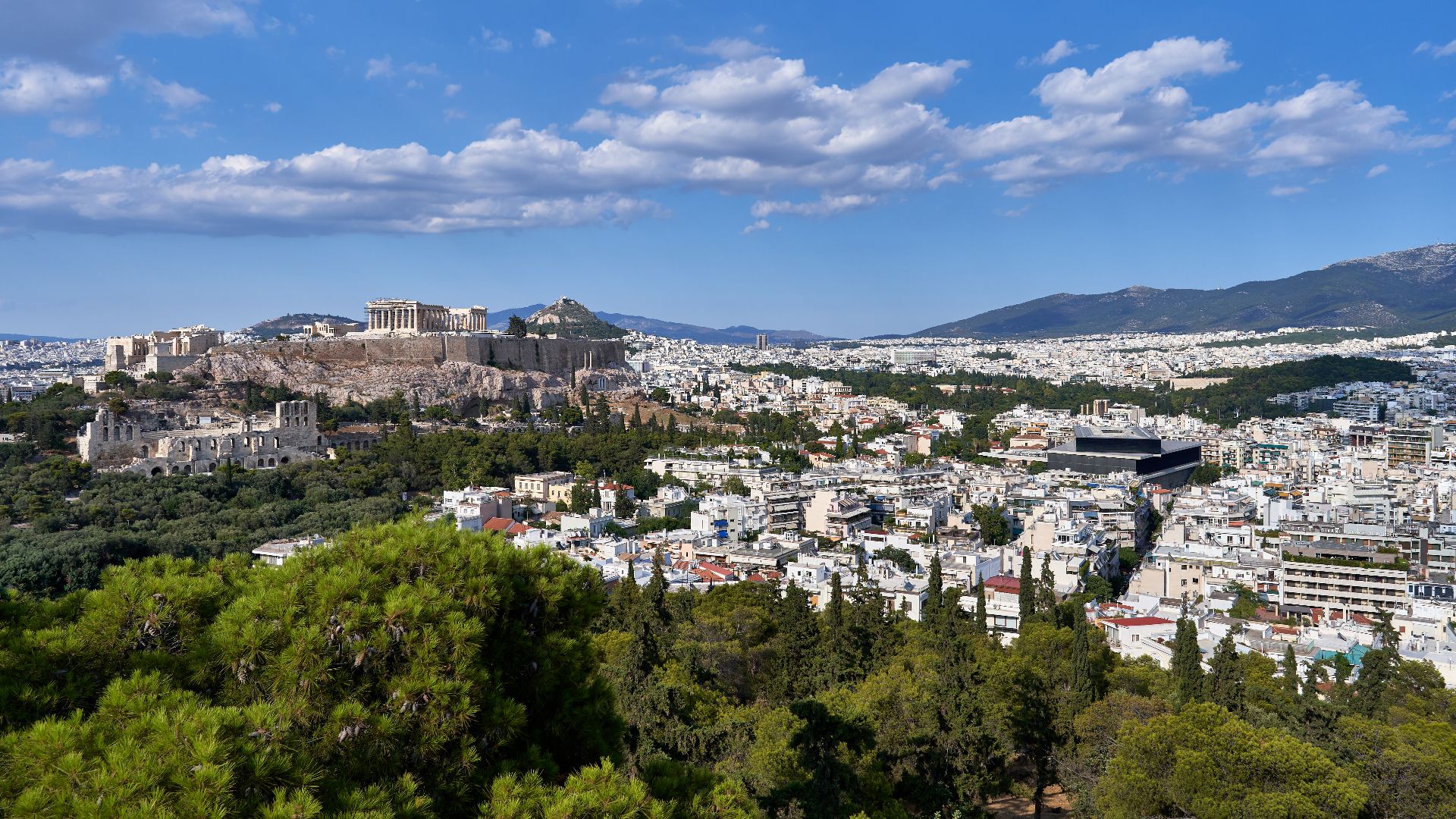 The Acropolis and Mount Hymettus from Philopappos Hill on July 18, 2019.