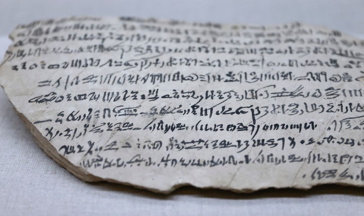 Getty Images - 1246620149 - Ostracon with hieratic script on a limestone at the Oriental Institute of the University of Chicago in Chicago, United States, on October 18, 2022.