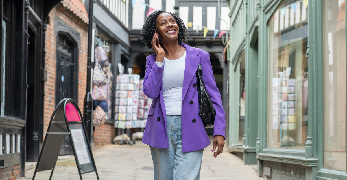Smiling woman talking by smart phone