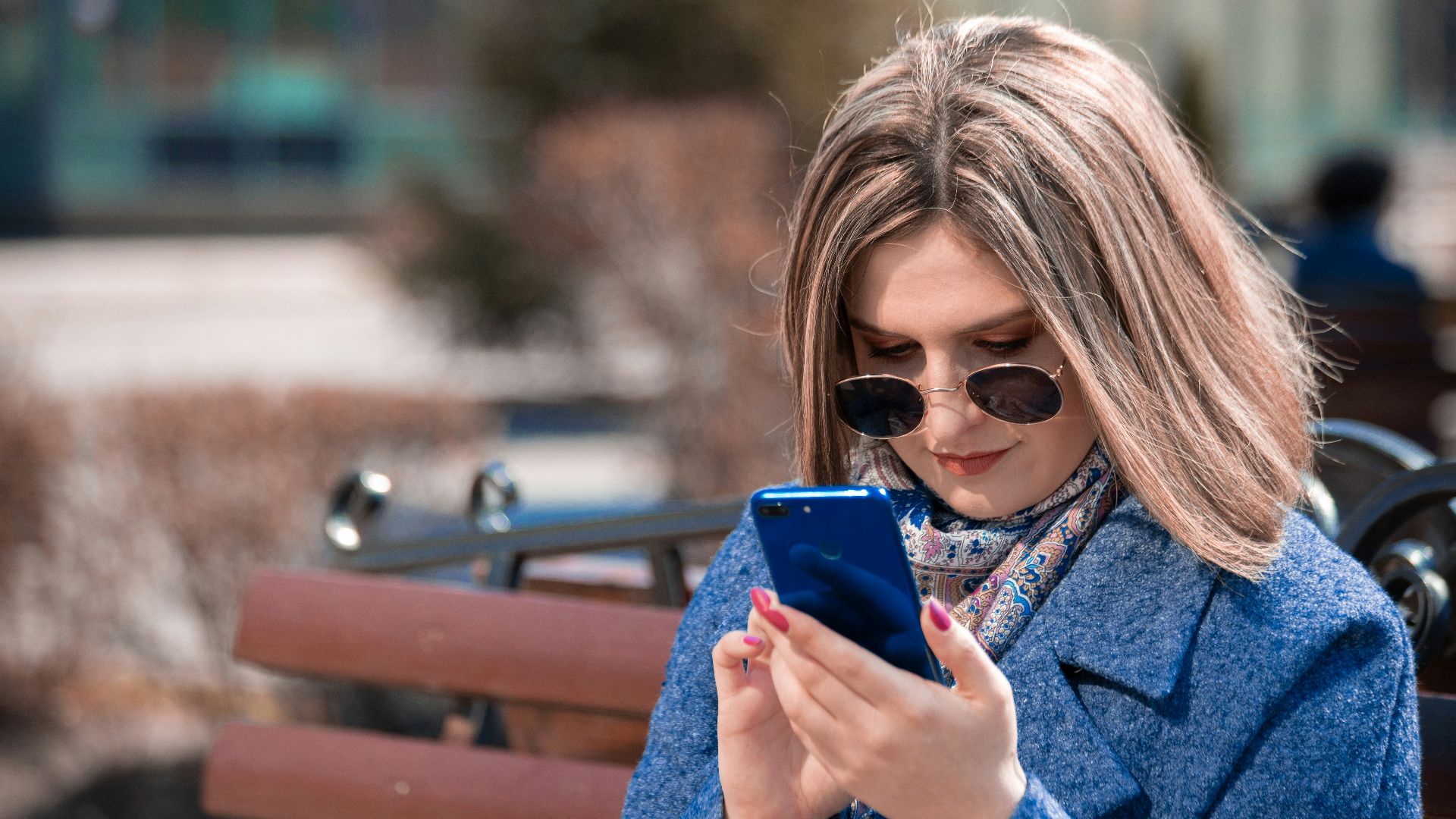 woman holding smartphone