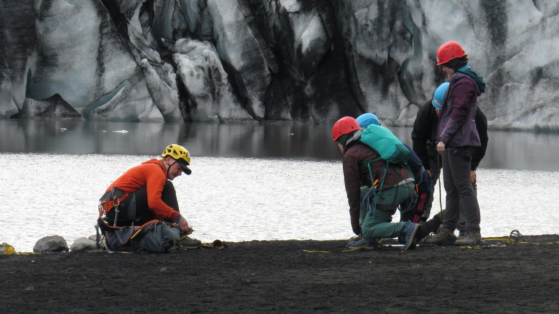 Group of climbers preparing for glacier hike at Vík í Mýrdal, Iceland.