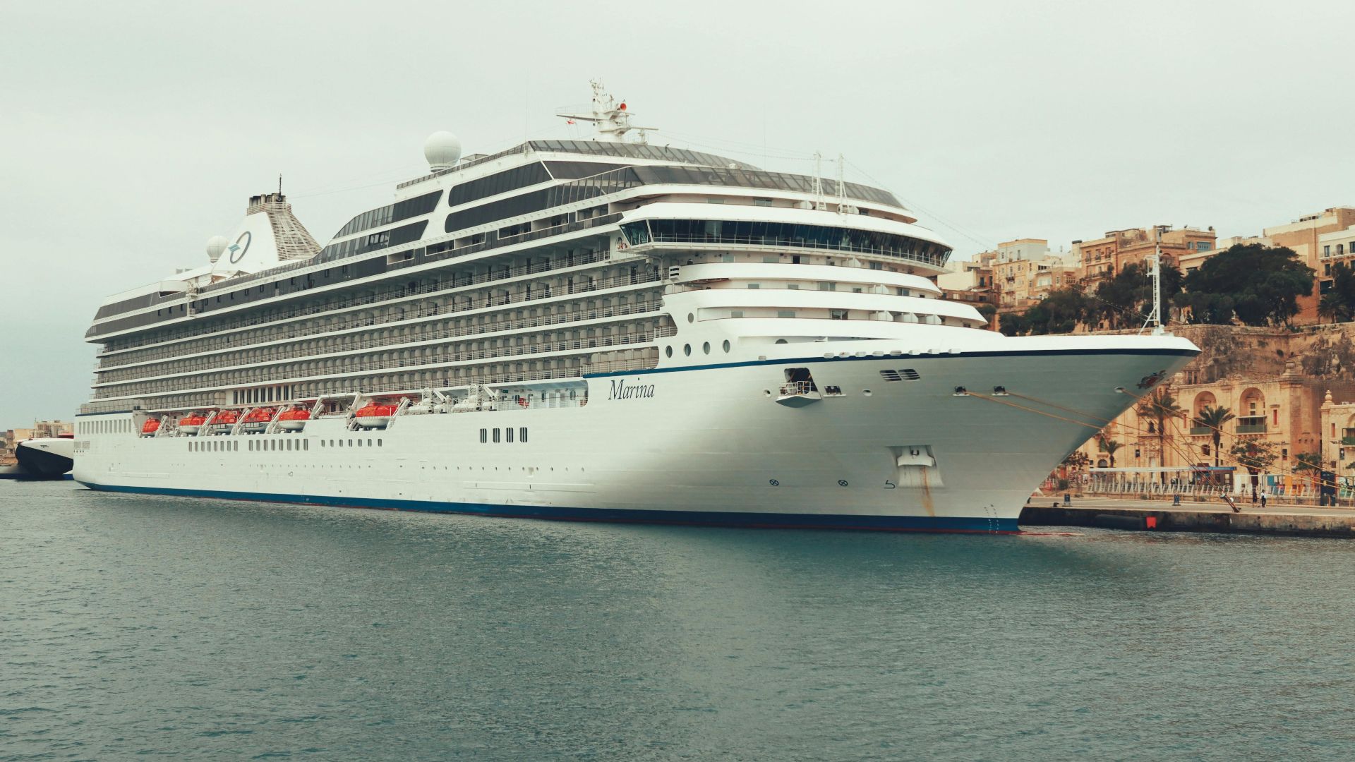 A luxurious cruise ship, MS Marina, moored in Valletta, Malta's scenic harbor.