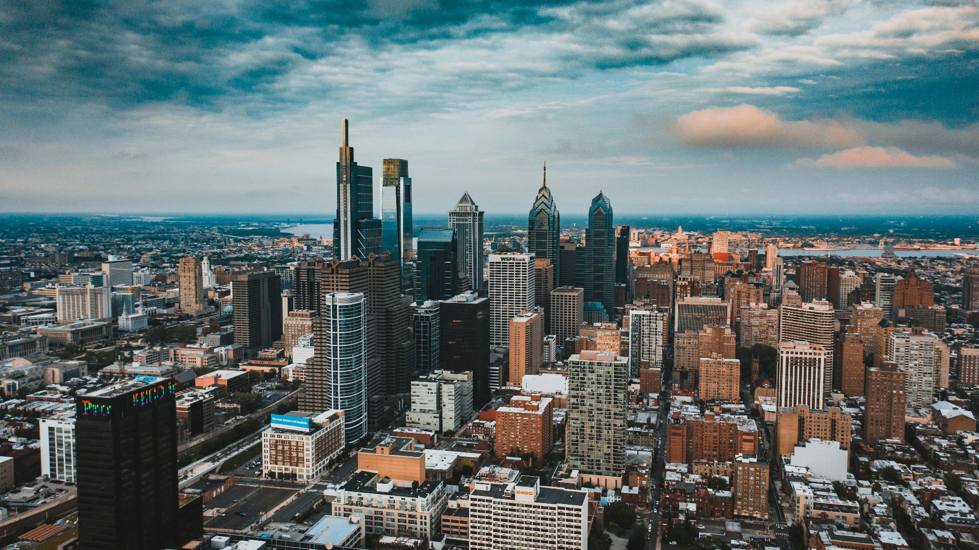 Aerial view of modern streets of Philadelphia city with skyscrapers and low buildings in America
