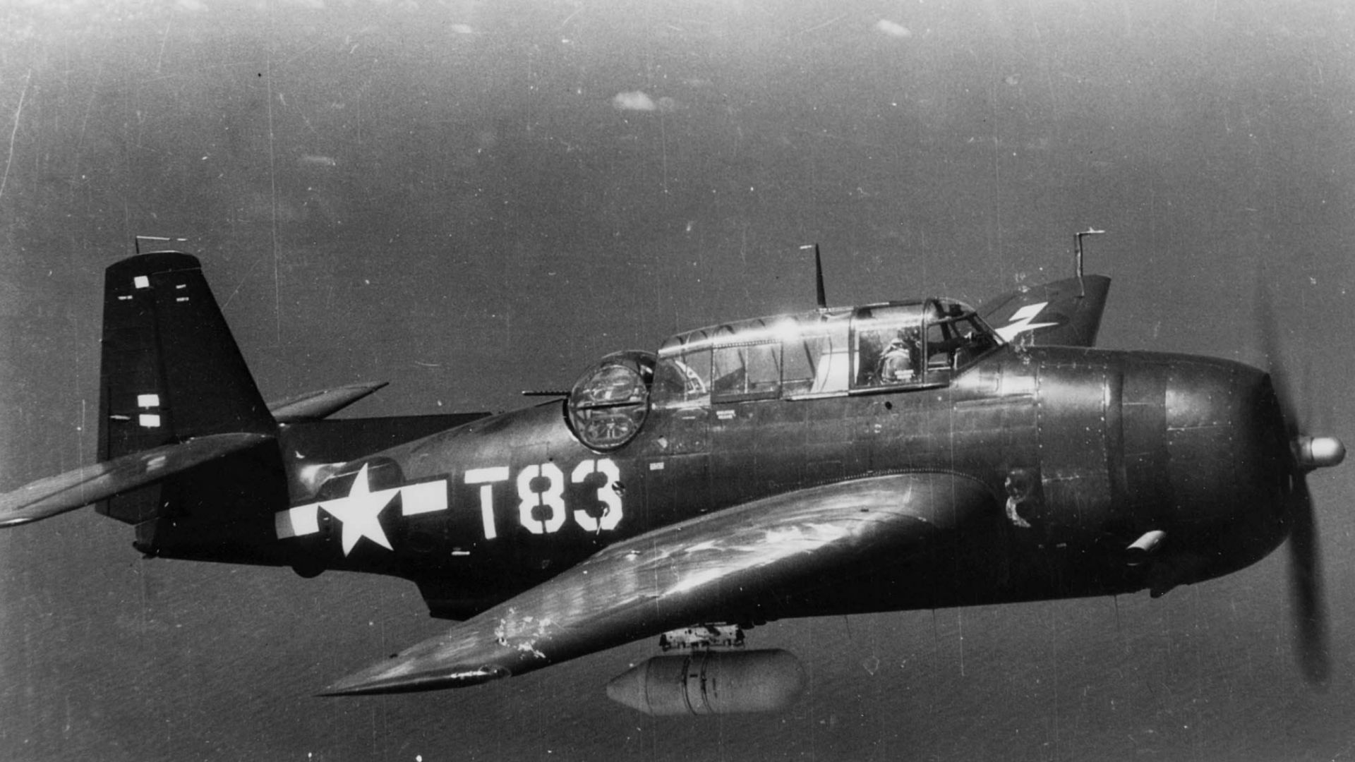 A U.S. Marine Corps Grumman TBM-3E Avenger of Marine Torpedo Bomber Squadron 234 (VMTB-234) assigned to the escort carrier USS Vella Gulf (CVE-111), in flight.