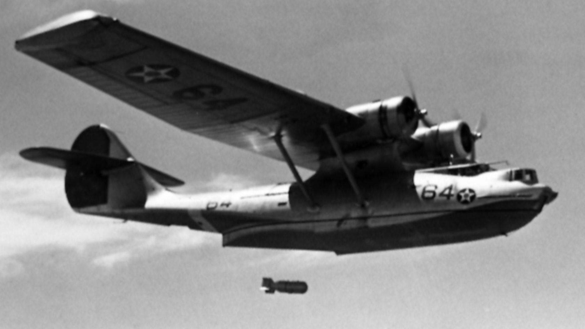 An early U.S. Navy Consolidated PBY Catalina dropping a depth charge.

Note: If the dating, 5 June 1942, is correct, then this PBY was used as a training plane, because it still wears the colourful pre-war markings.