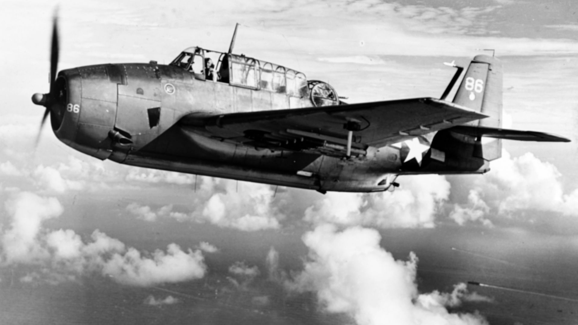 A U.S. Navy General Motors TBM-1C Avenger of Torpedo Squadron 2 (VT-2) enroute to Saipan, circa in June 1944. VT-2 was assigned to Carrier Air Group 2 (CVG-2) aboard the aircraft carrier USS Hornet (CV-12) in mid-1944. Aircraft from Hornet were identified by the white circle on the tail.