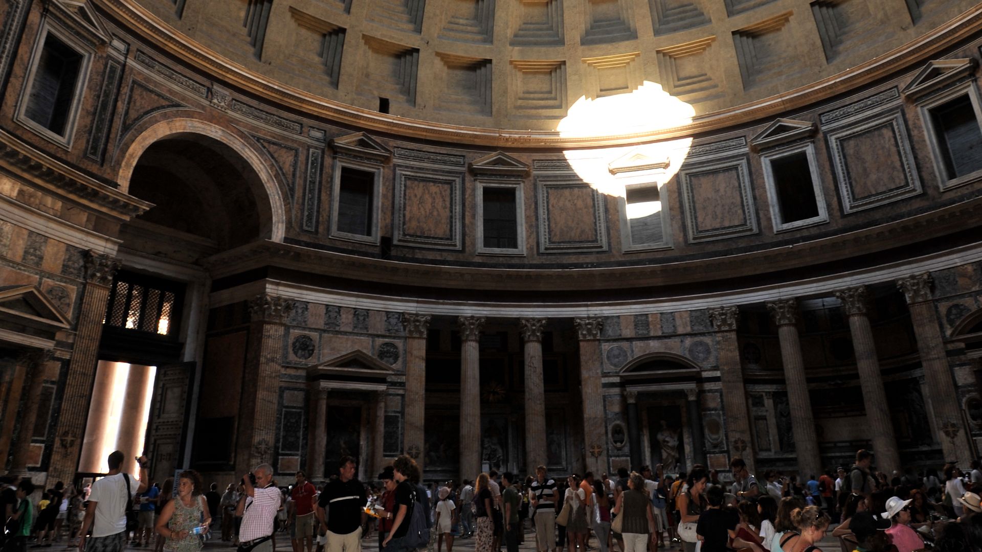 The Pantheon in Rome is the much celebrated building that has survived in excellent condition since antiquity. It bears the architects name on its facade and it was originally built to honor ALL the Gods.  And based on its good condition it has received their blessing.   Every dome or municipal building ever built, has copied some aspect of this evenly proportioned structure.  The only light entering the building is through upper opening of the dome or oculus and its doorway.  Rome, Italy