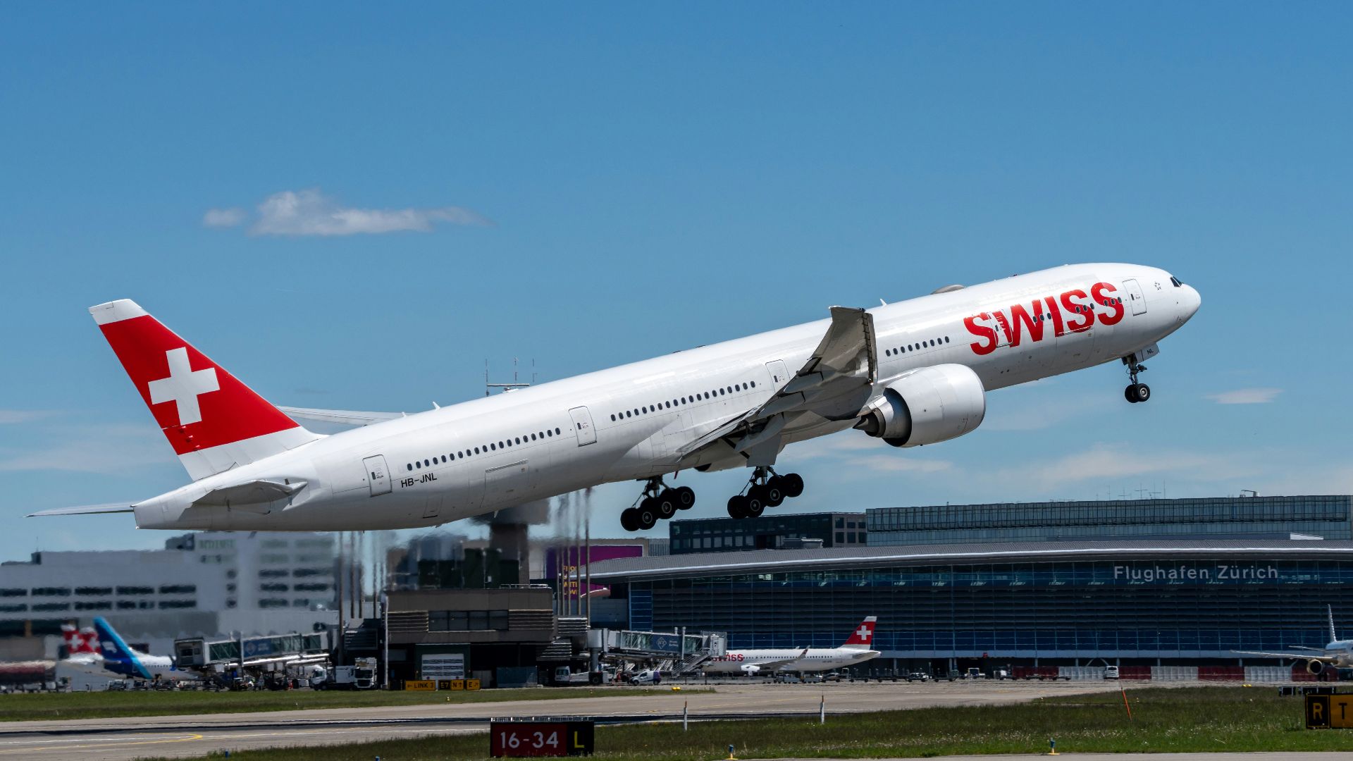 a large passenger jet taking off from an airport runway