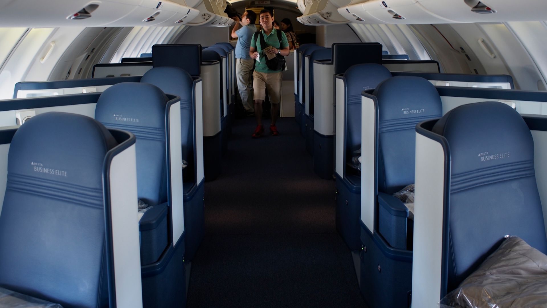 View of the reconfigured Business Elite upper deck cabin on Delta's 747-400. Very spacious and comfortable arrangement. Taken while boarding DL277 from Honolulu to Osaka Kansai. A very full flight today with only a few seats left open in the whole airplane.