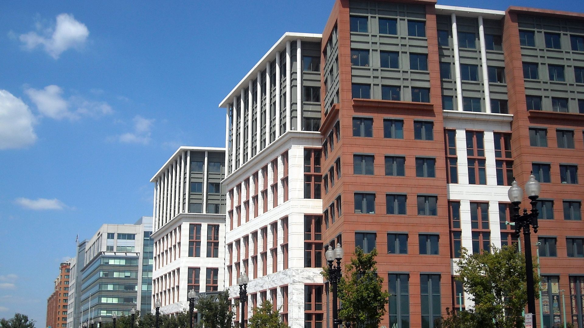 The United States Department of Transportation headquarters, located at 1200 New Jersey Avenue, S.E., in the Navy Yard neighborhood of Washington, D.C.  The dome of the United States Capitol is visible in the background.