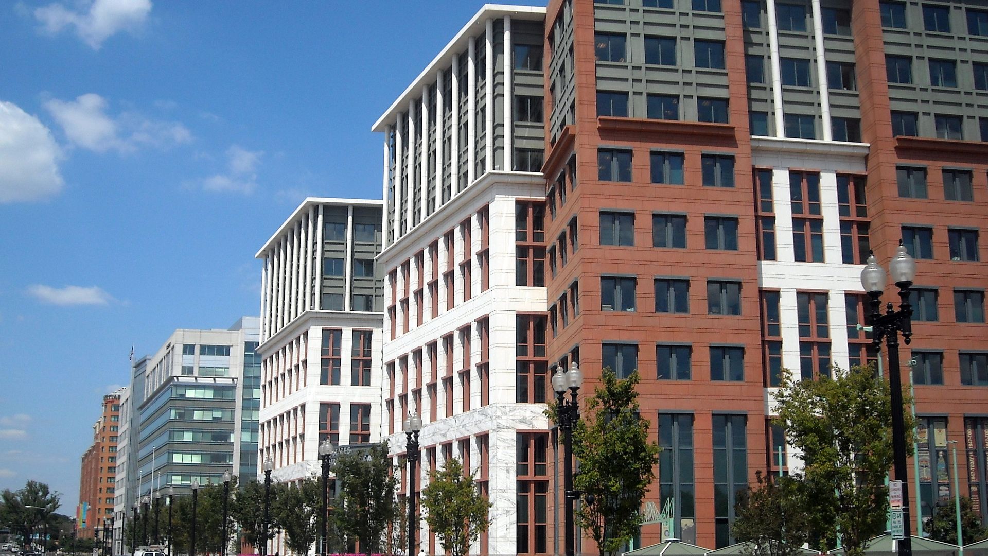 The United States Department of Transportation headquarters, located at 1200 New Jersey Avenue, S.E., in the Navy Yard neighborhood of Washington, D.C.  The dome of the United States Capitol is visible in the background.