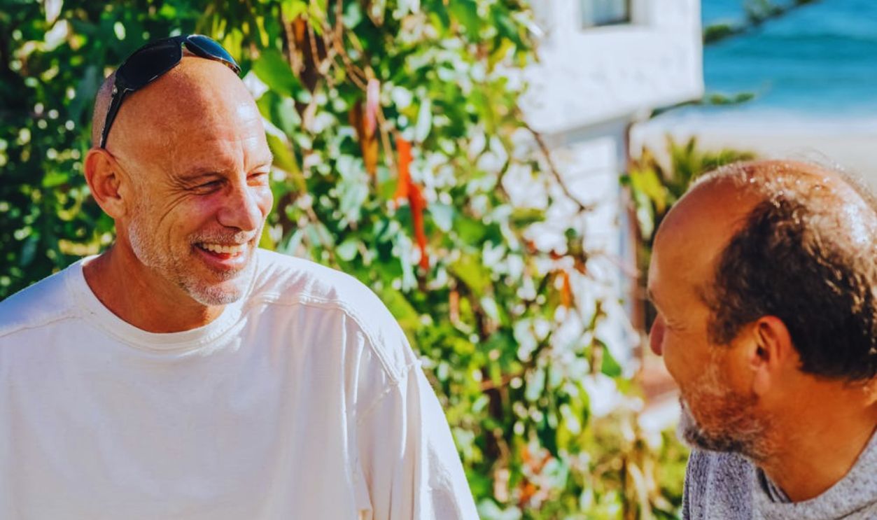 Two Men Talking Together