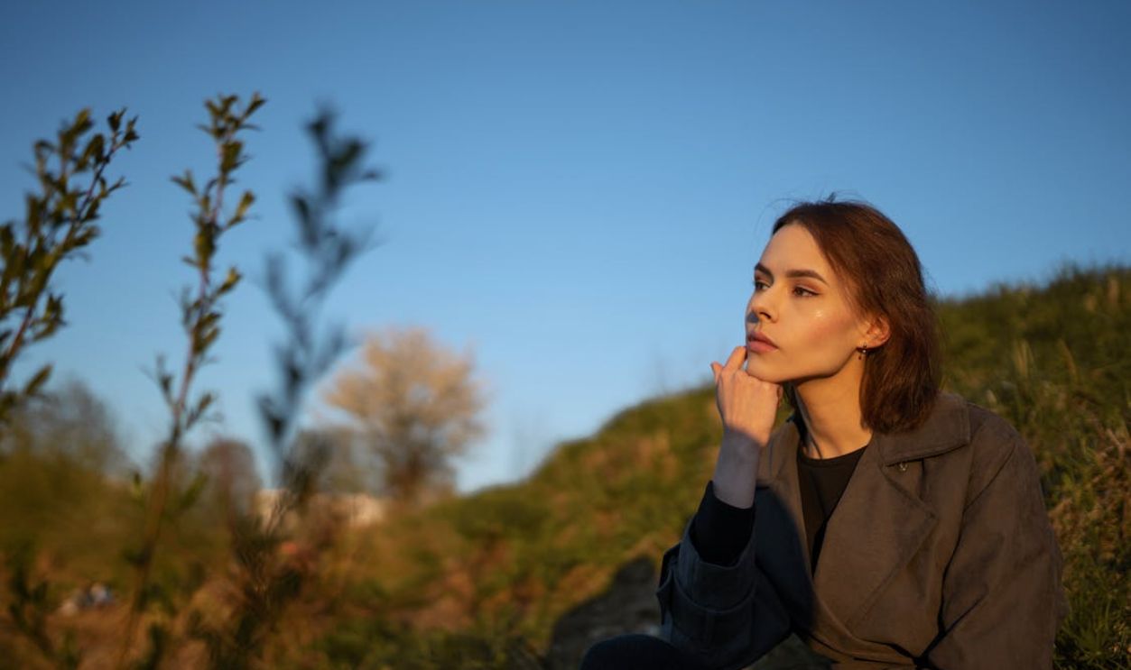 Girl Sitting on a Hill