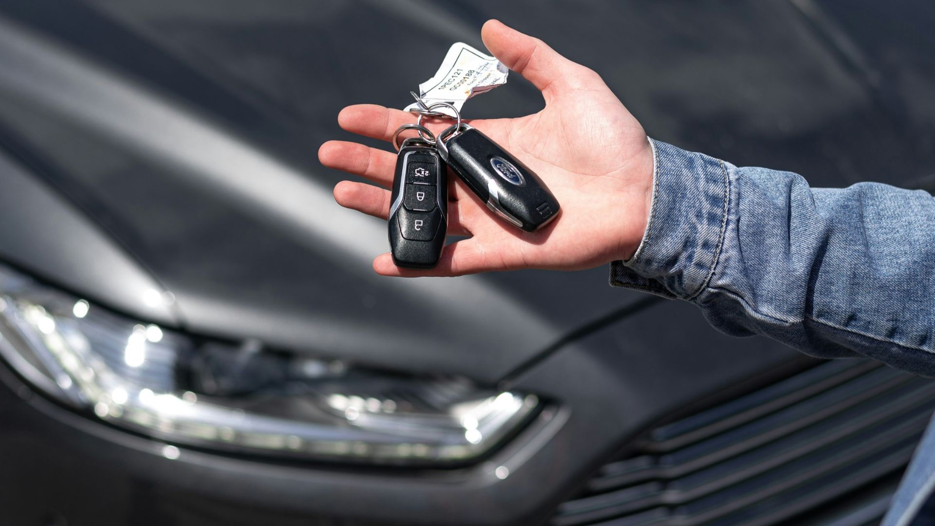 a hand holding a key