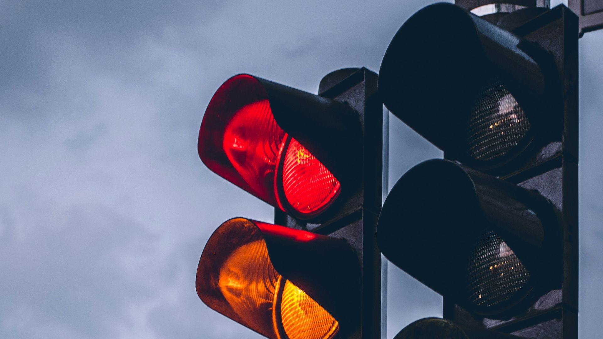 street traffic lights on red and orange