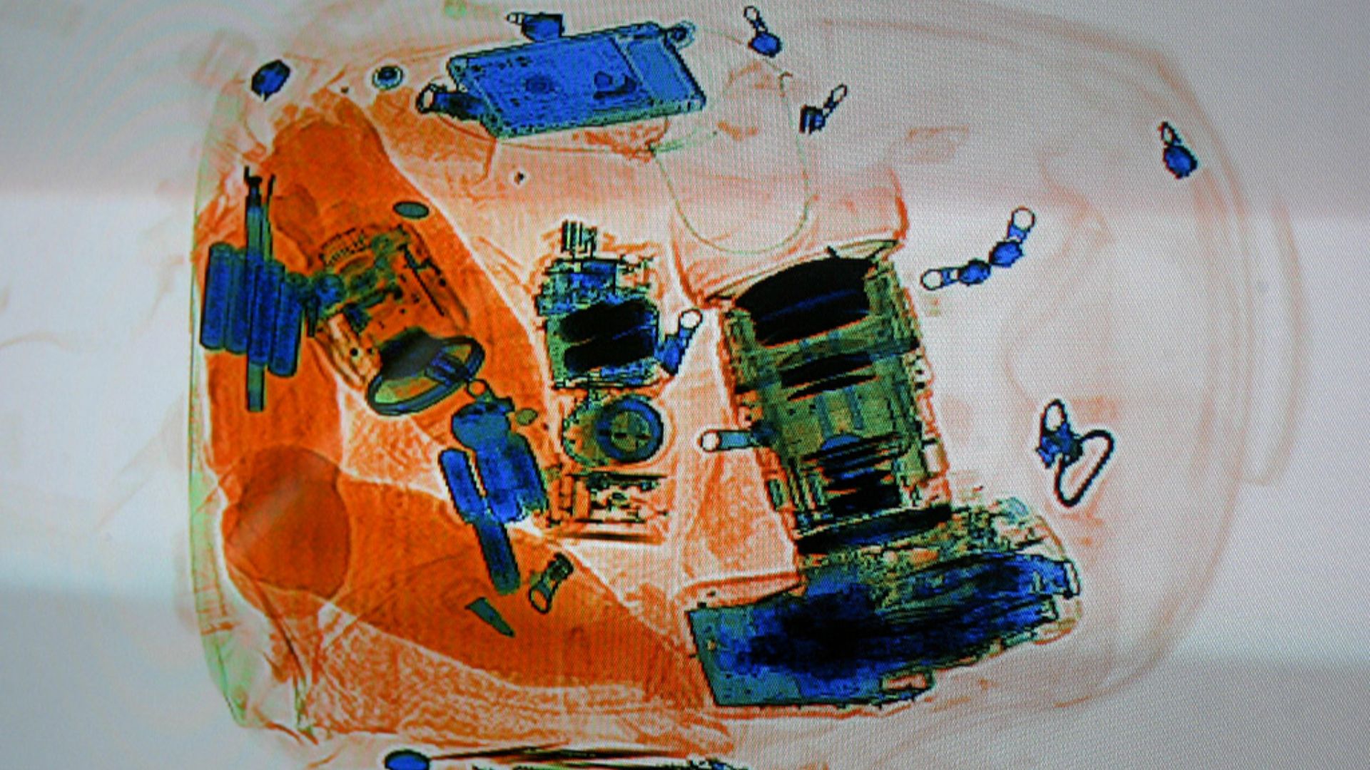 Photograph of a baggage screening x-ray display, taken at the Verkehrshaus (Swiss Museum of Transport). Lucern, Switzerland on October 23, 2006 by Duke