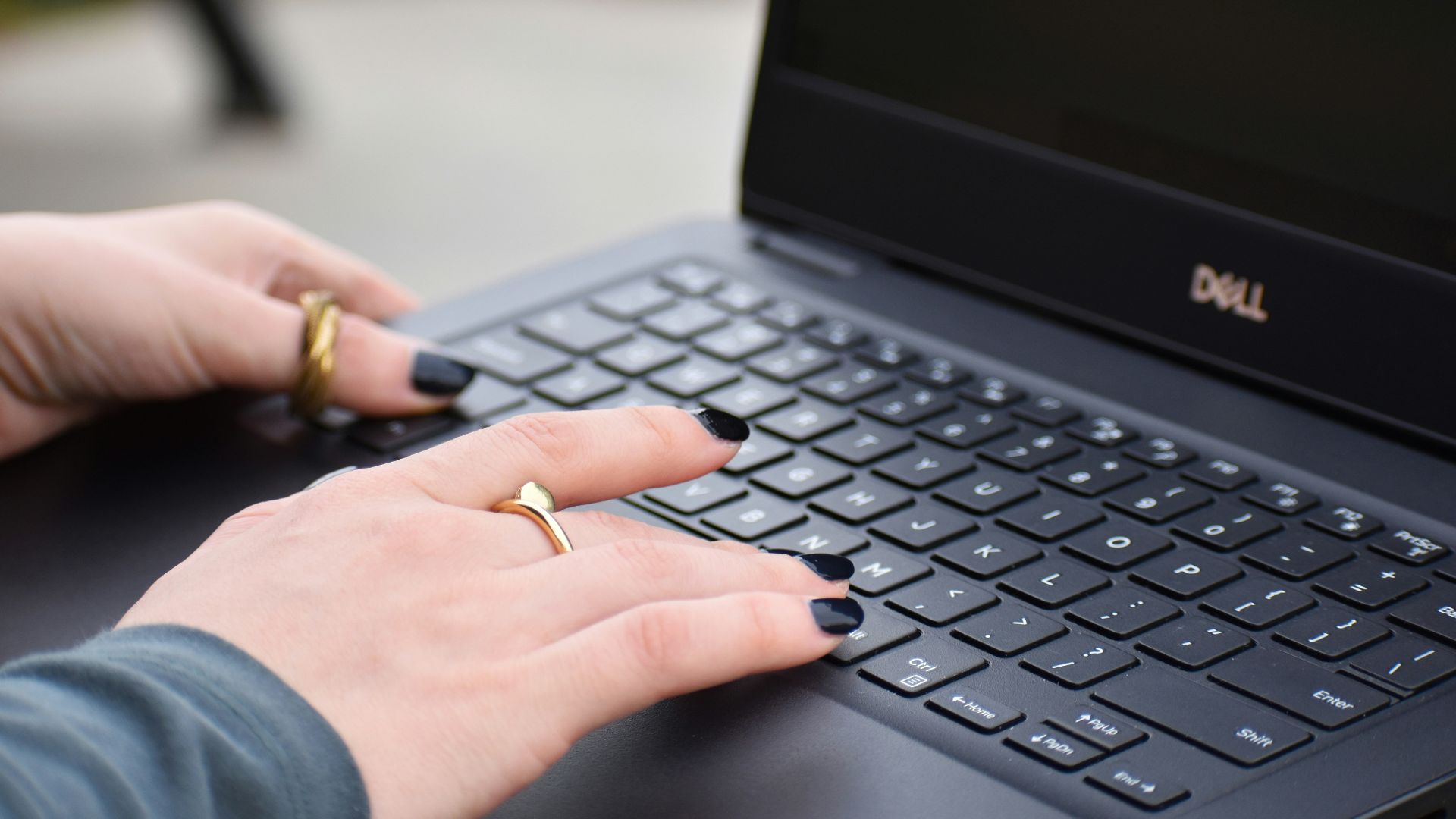 a person typing on a laptop