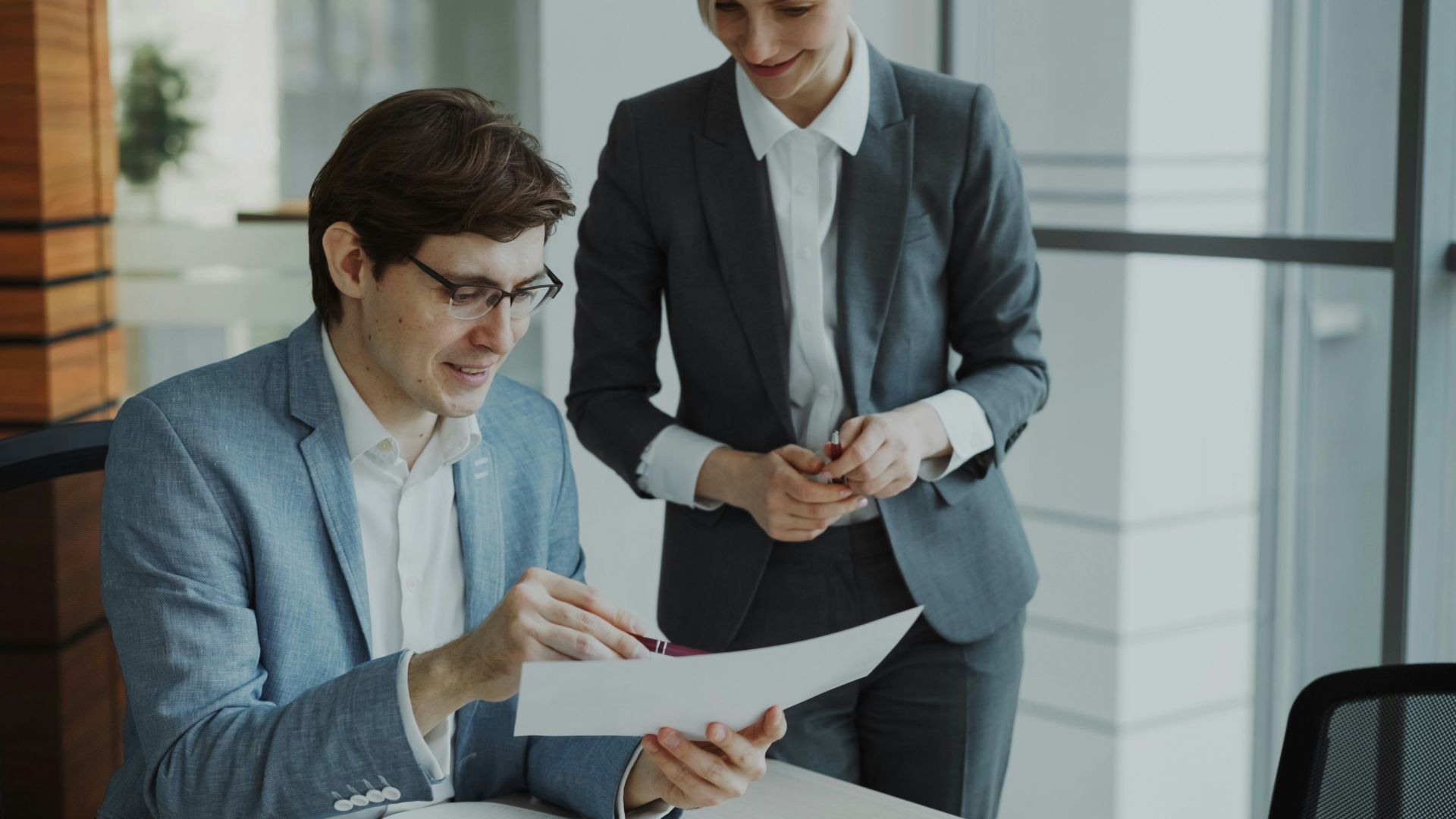 Two business people reviewing documents together