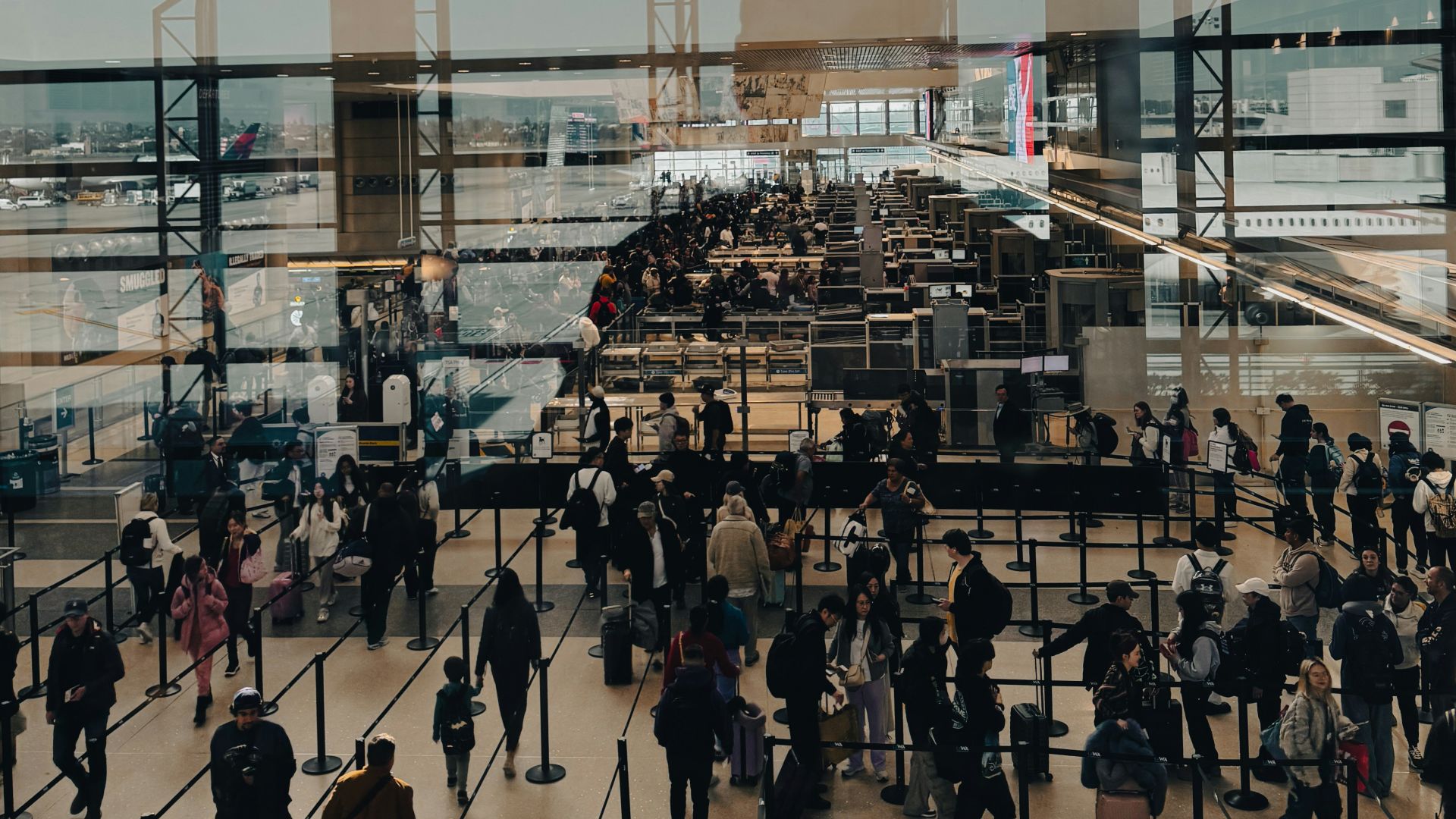A large group of people walking around a building
