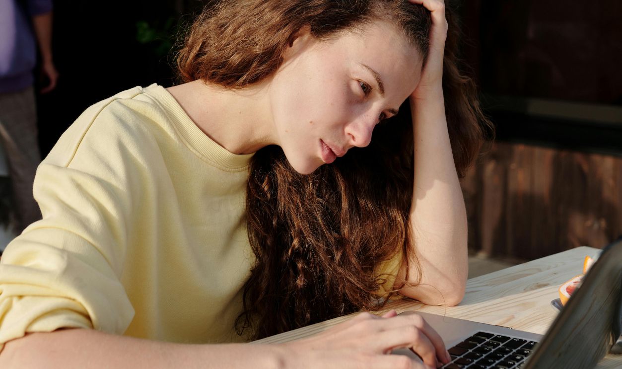 A Woman Sitting at the Table