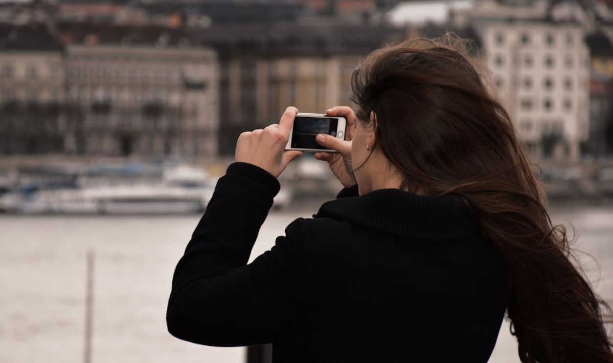 Woman Taking Photo Using a Smartphone