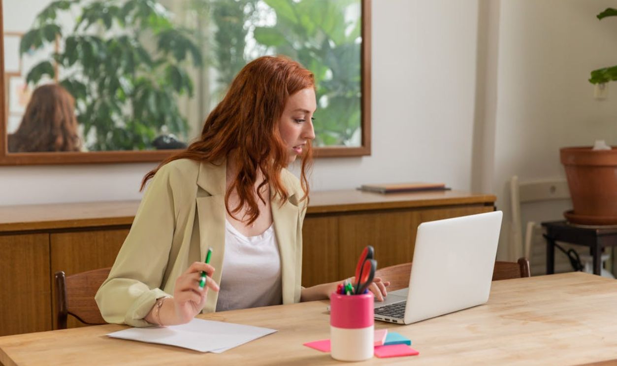 Woman Browsing on a Laptop