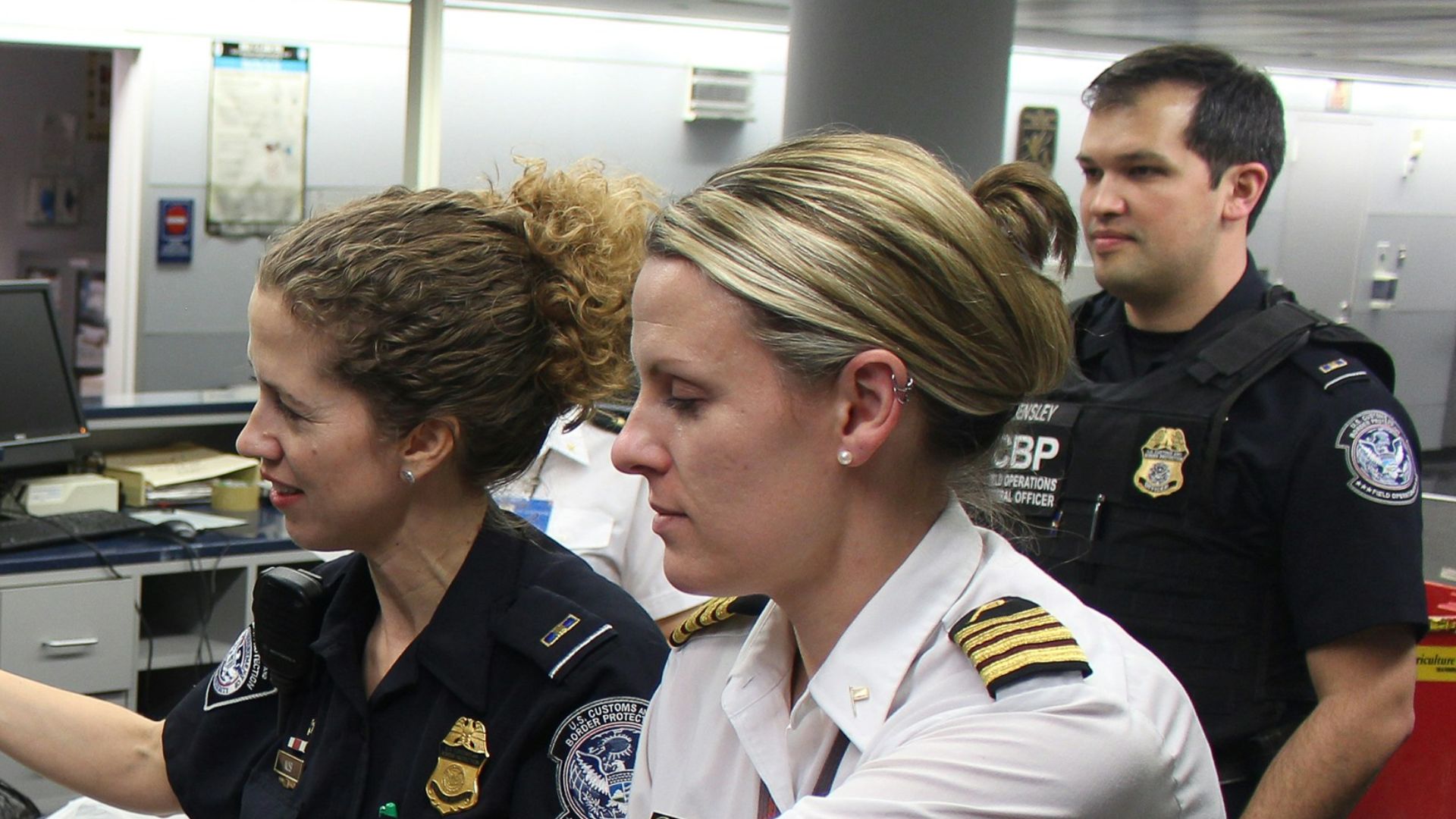 woman in black crew neck t-shirt standing beside woman in white t-shirt