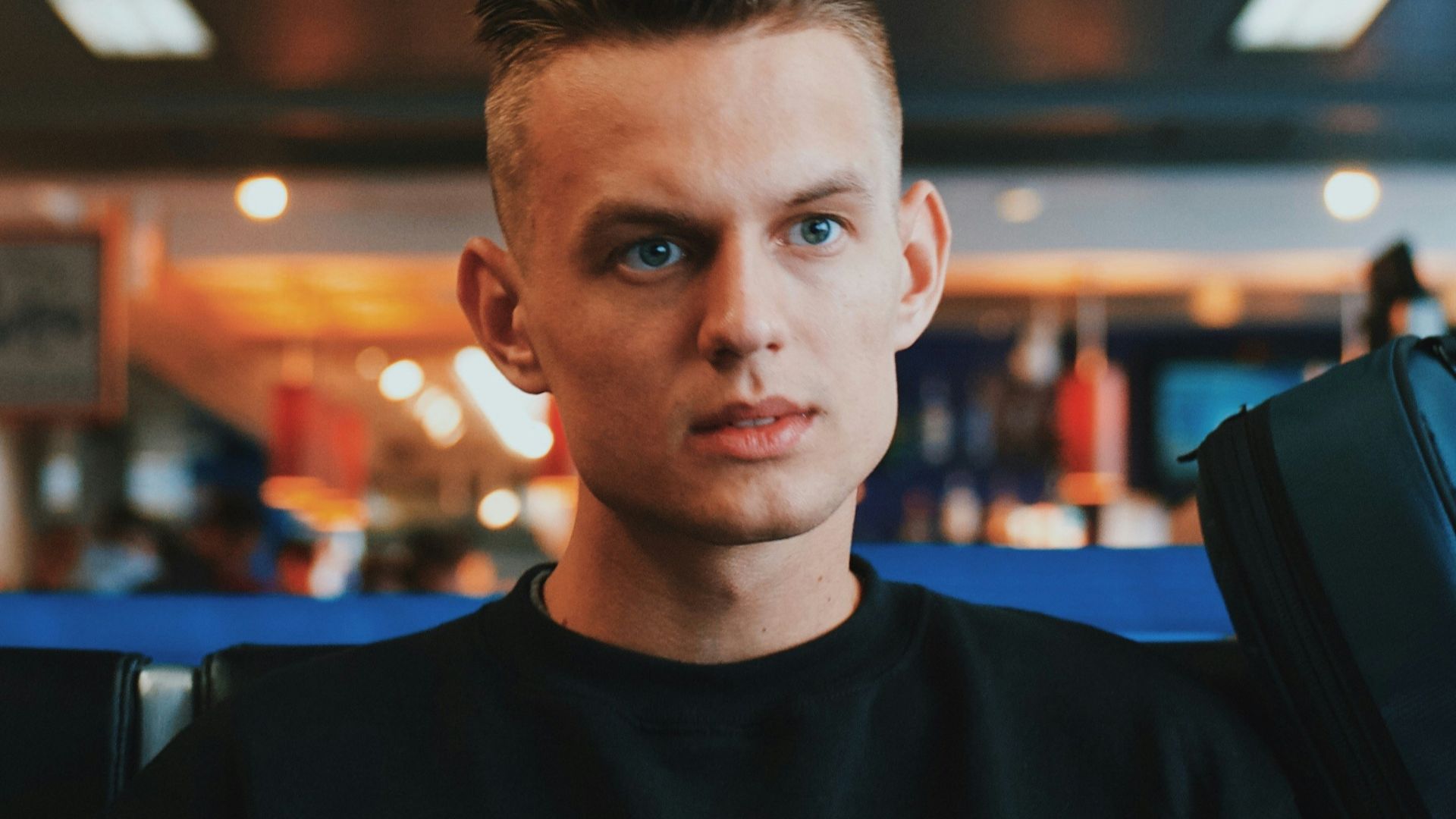 man wearing black crew-neck dress