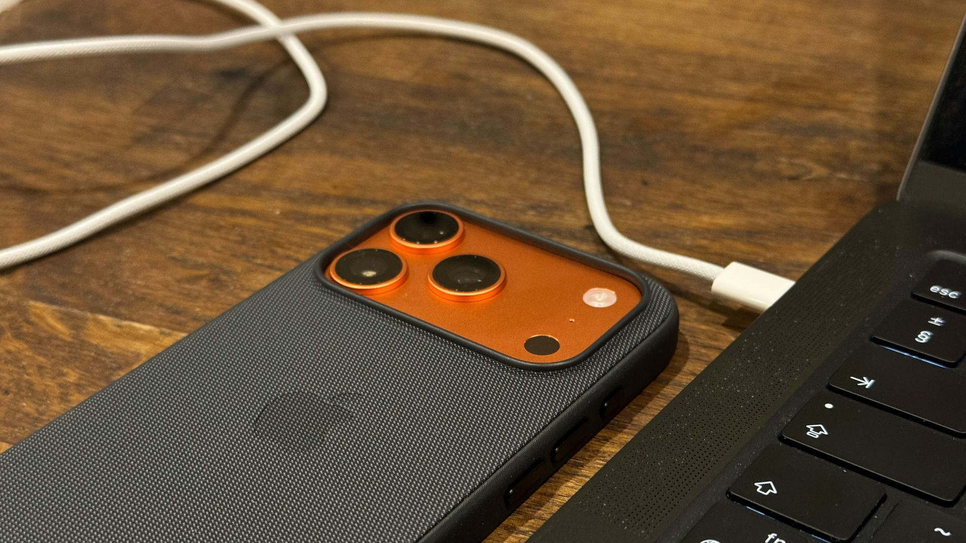 Smartphone connected to a laptop with a cable