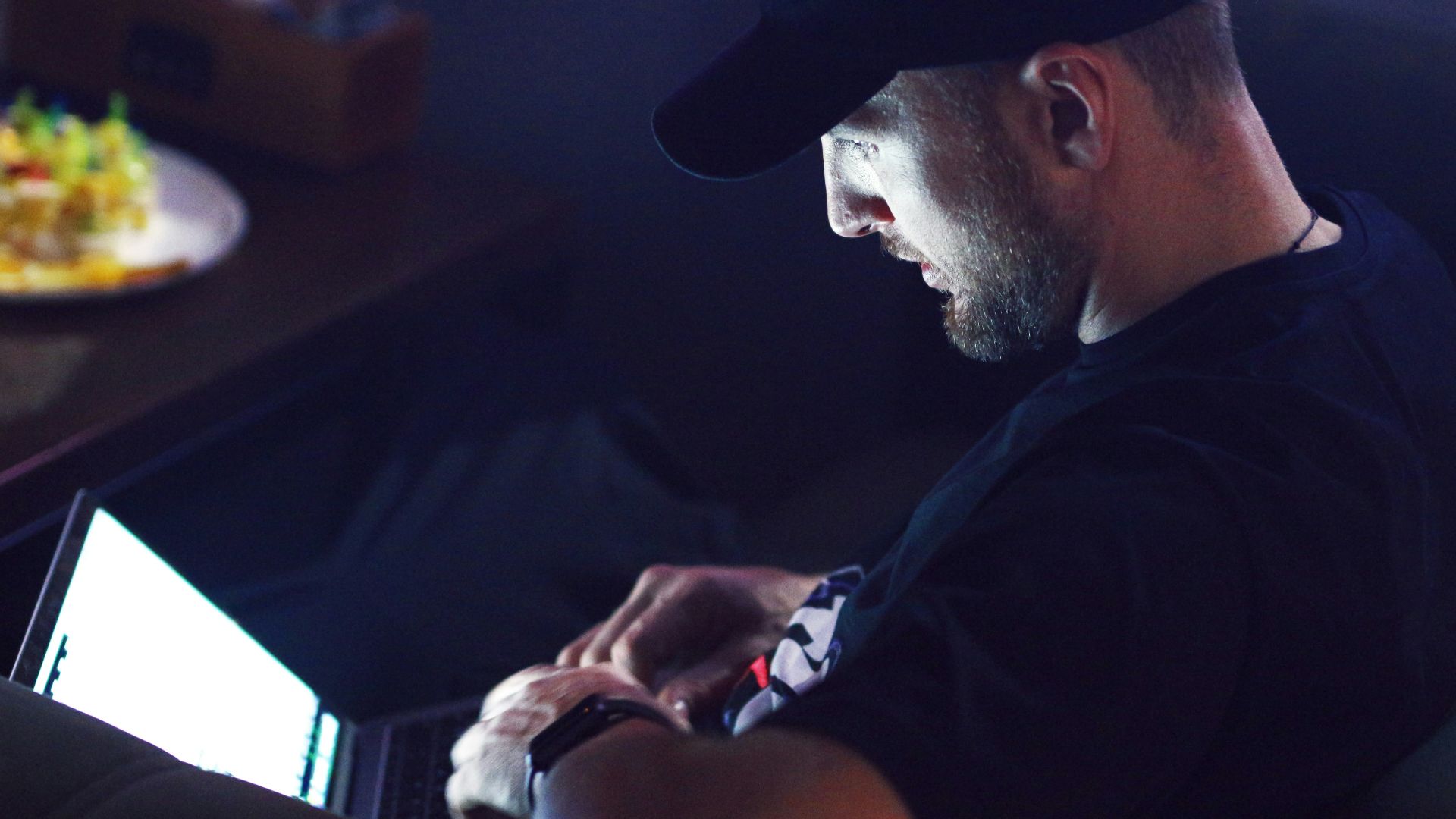 a man sitting in front of a computer