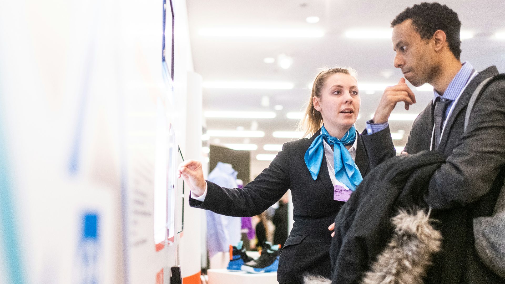 man and woman talking near the wall