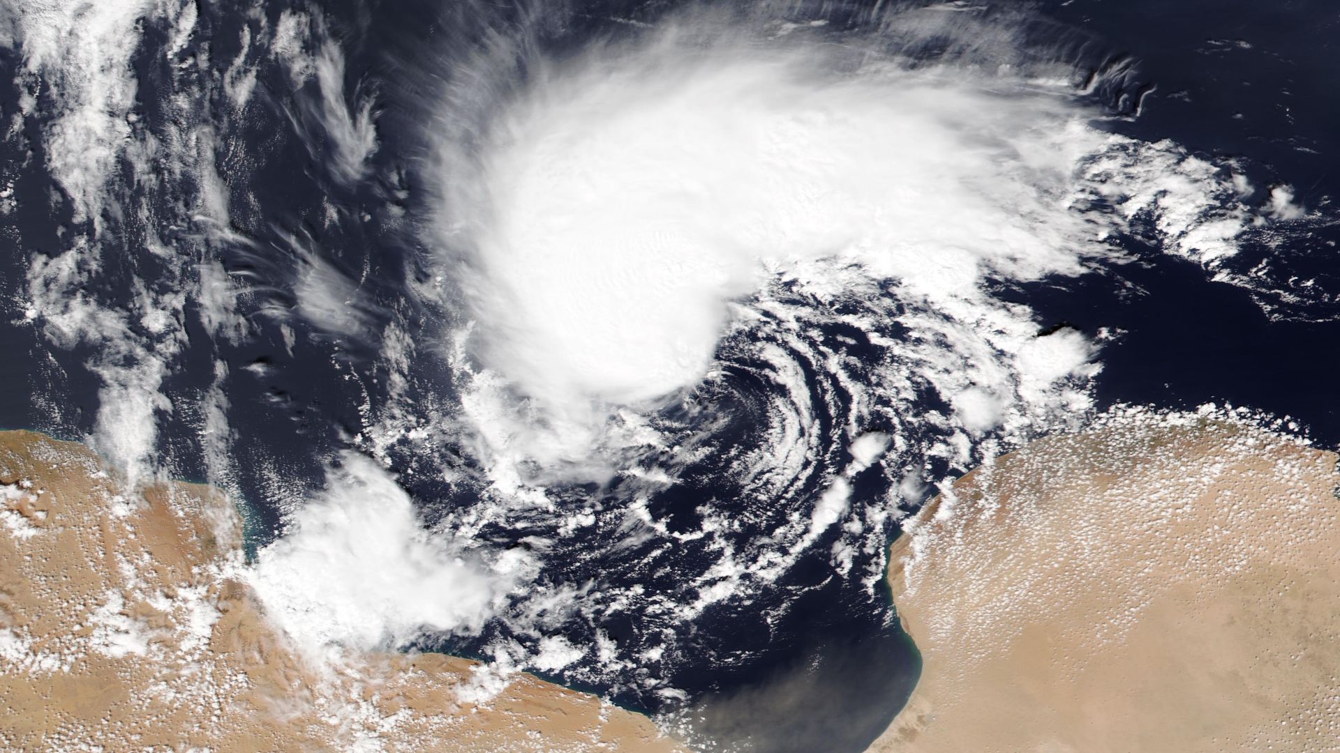 NASA satellite image of Storm Daniel, also known as Medicane Daniel, on September 9, 2023, as the storm was approaching landfall in Libya. The storm later triggered the Derna dam collapses, leading to catastrophic flooding that killed at least 18,000–20,000 people, and cost at least $19 billion in damage.