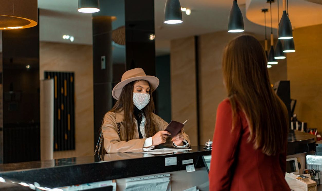 A Woman Standing at the Counter