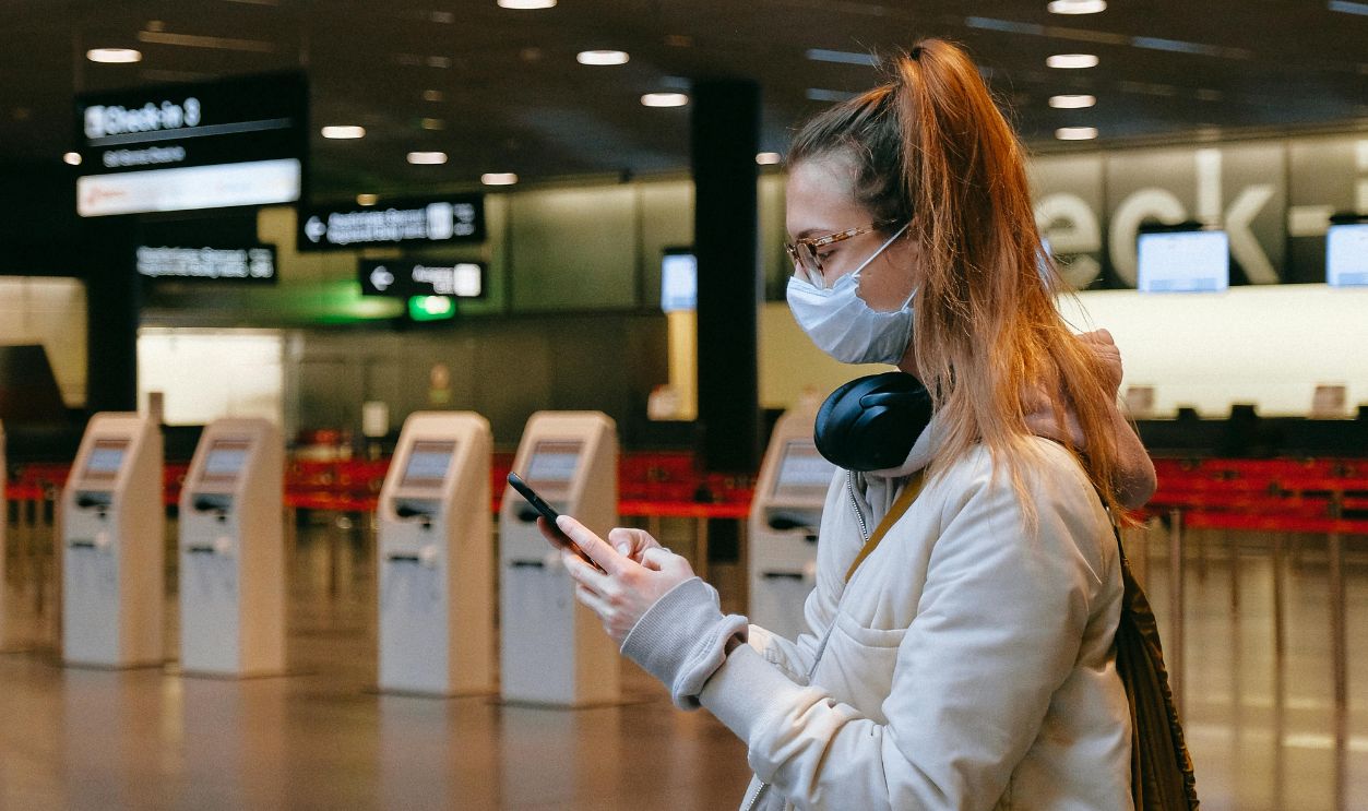 Woman With a Face Mask Texting