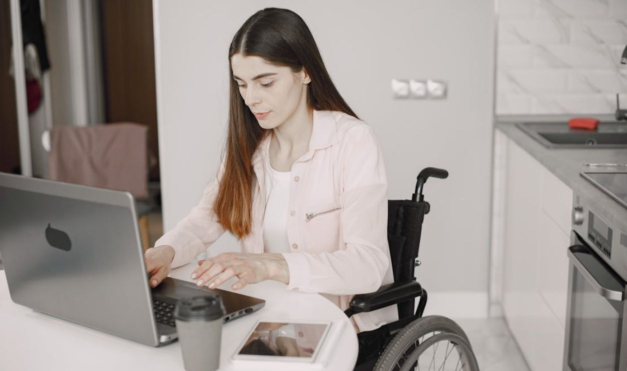 A Woman on a Wheelchair Working