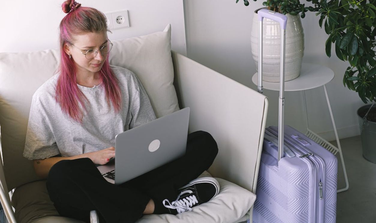 Young Woman Working Remotely with Laptop in Cozy Space