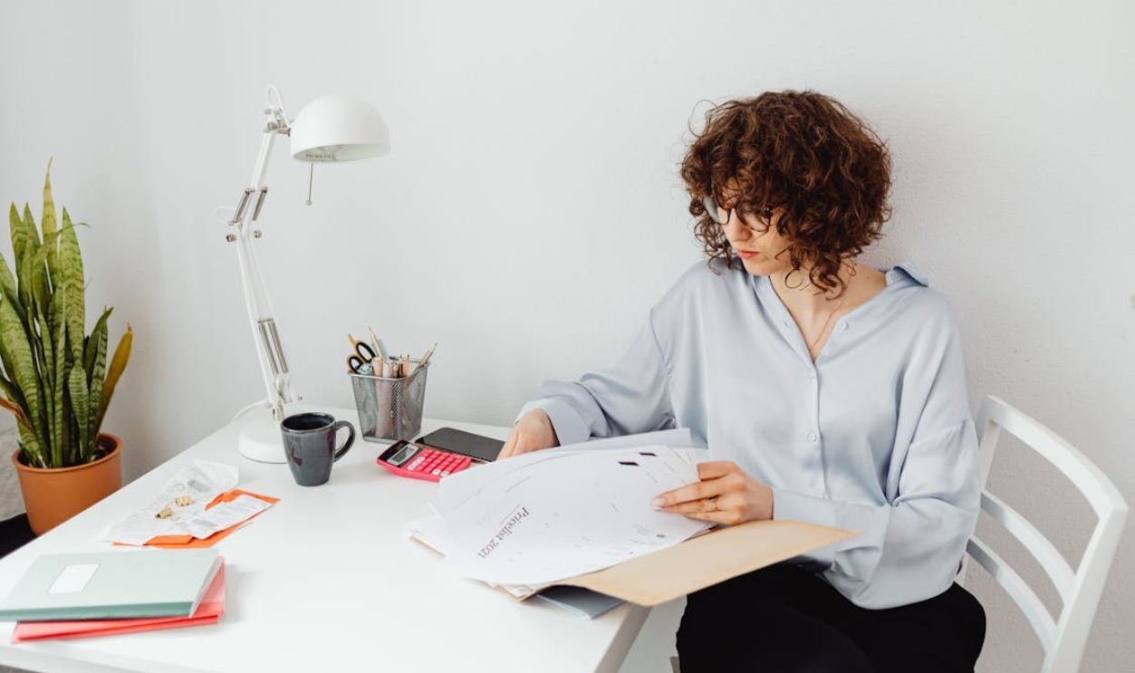 A Woman Looking at Documents