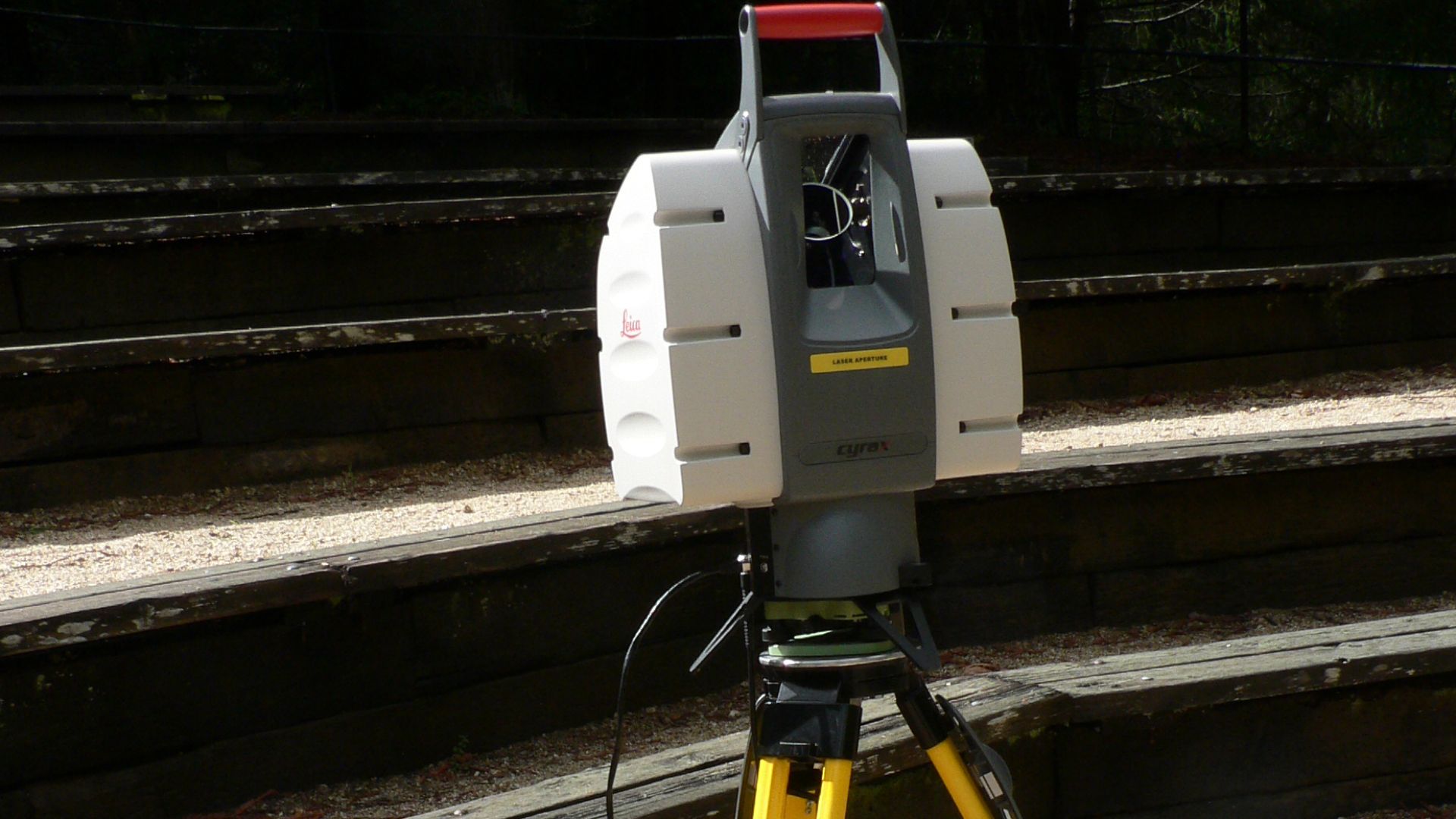This Leica terrestrial lidar (light detection and ranging) scanner (TLS) may be used to scan buildings, rock formations, etc., to produce a 3D model.
The TLS can aim its laser beam in a wide range: its head rotates horizontally, a miror flips vertically. The laser beam is used to measure the distance to the first object on its path.
Model: Leica HDS-3000

The Lidar was being demonstrated at UC Santa Cruz when the photo was taken.