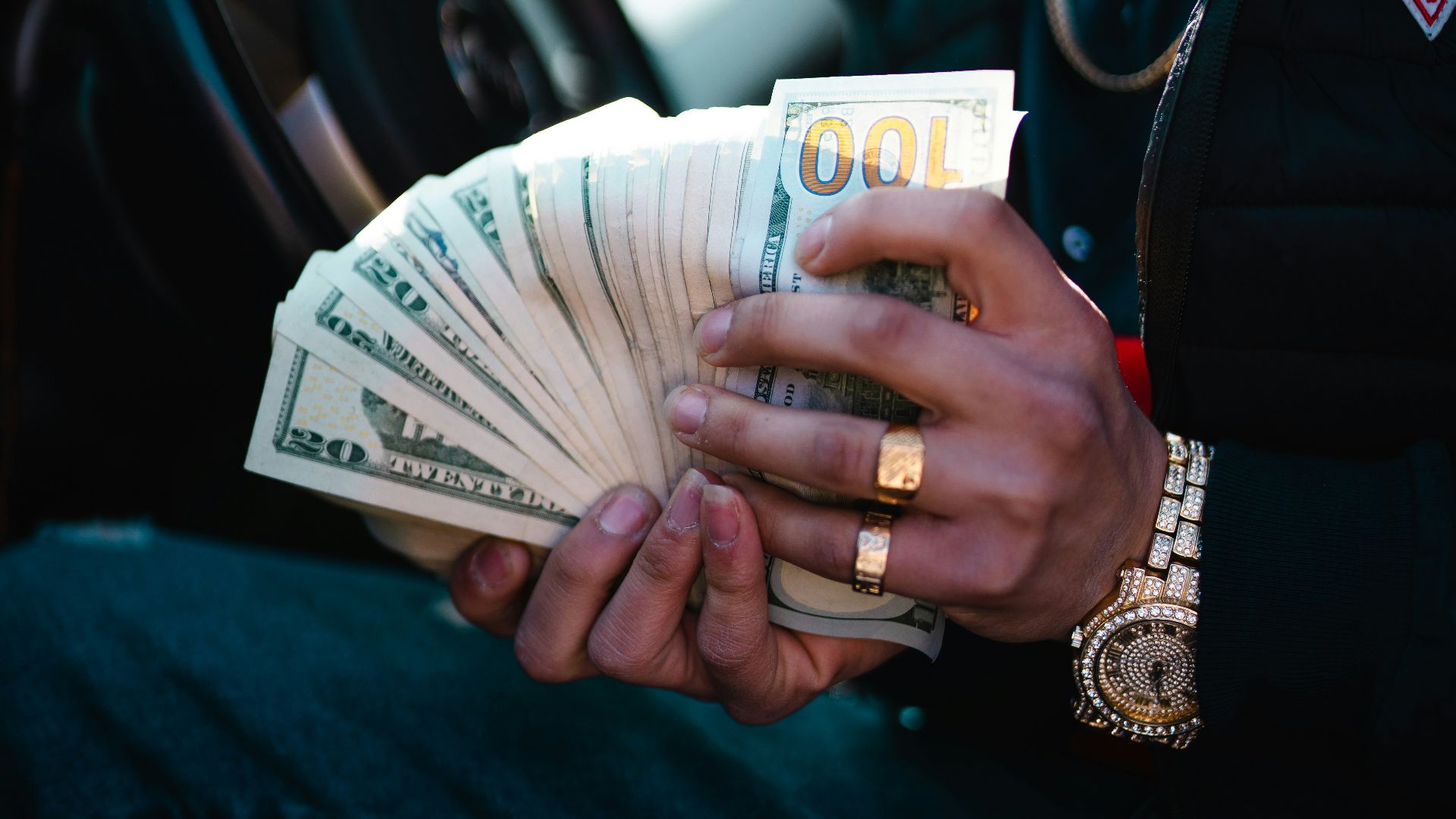man in blue dress shirt holding white ceramic mug