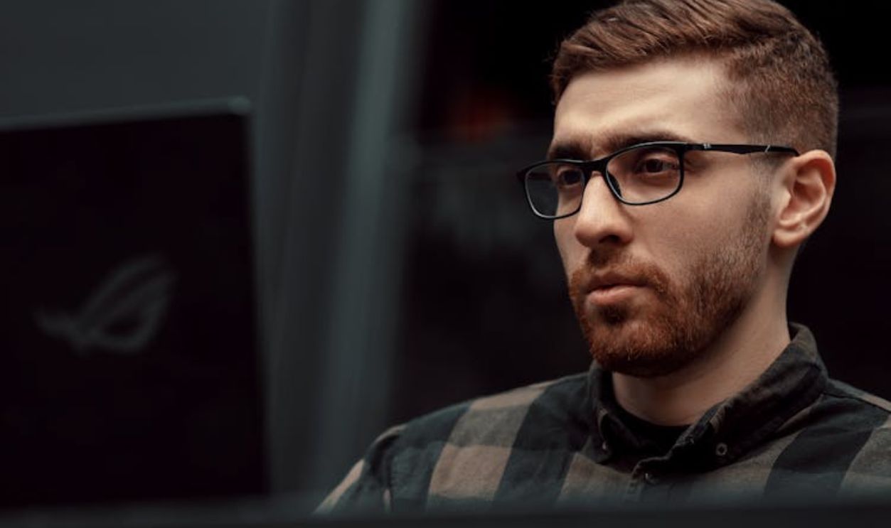 Portrait of Man Wearing Eyeglasses and Checked Shirt
